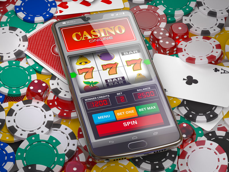 online casino. slot machine on smartphone screen, dice, casino c